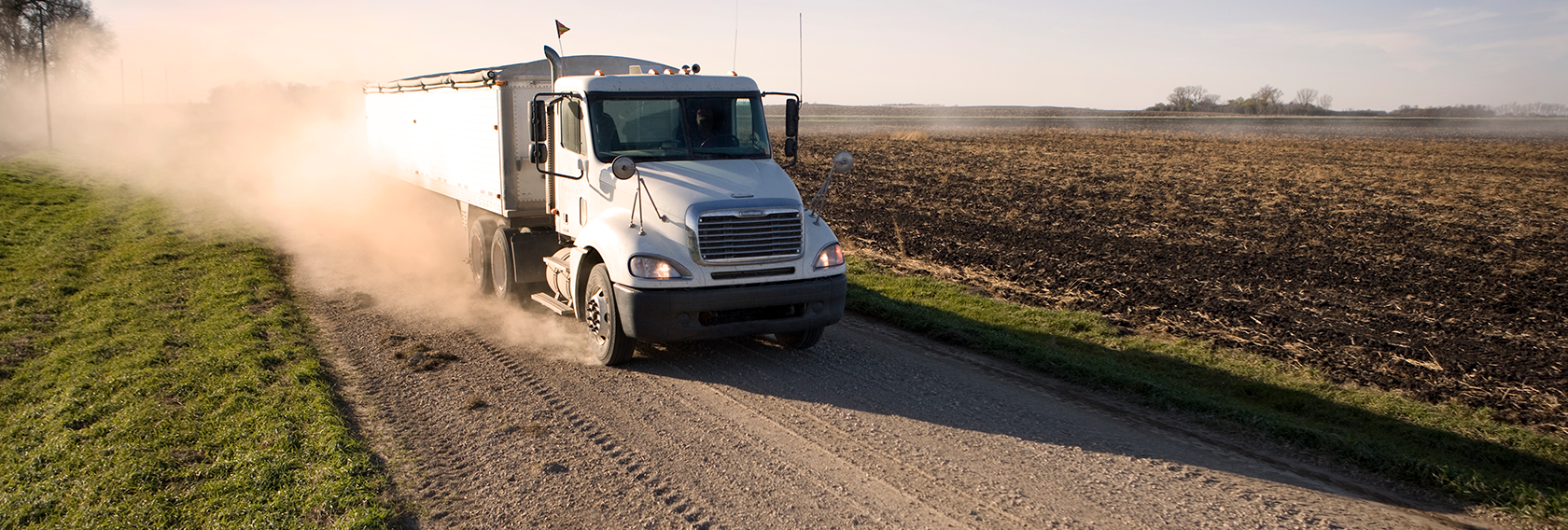 grain truck on dirt road