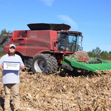 man in front of tractor