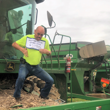 man in front of tractor